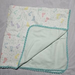 New* handmade baby feet and turquo one of a kind baby blanket approx. 32" by 34"